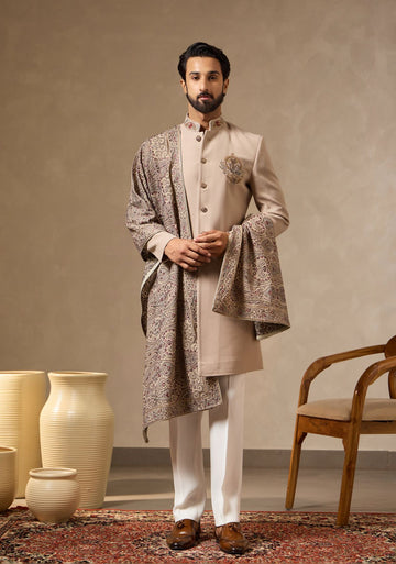 Fawn Beige Embroidered Sherwani Set with Statement Crest Motif, Heavy Embroidered Dupatta & Bootcut Pants